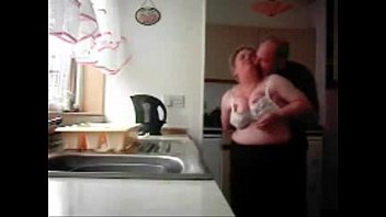 Mum and dad home alones having fun in the kitchen. Hidden cam