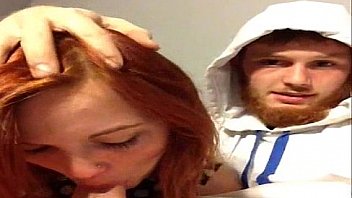 horny redhead blowing cock