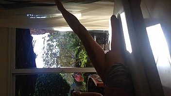 Amateur fucking teen in front of window