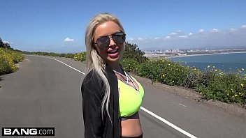 MILF Nina Elle shows off her big tits and gives a roadside blowjob
